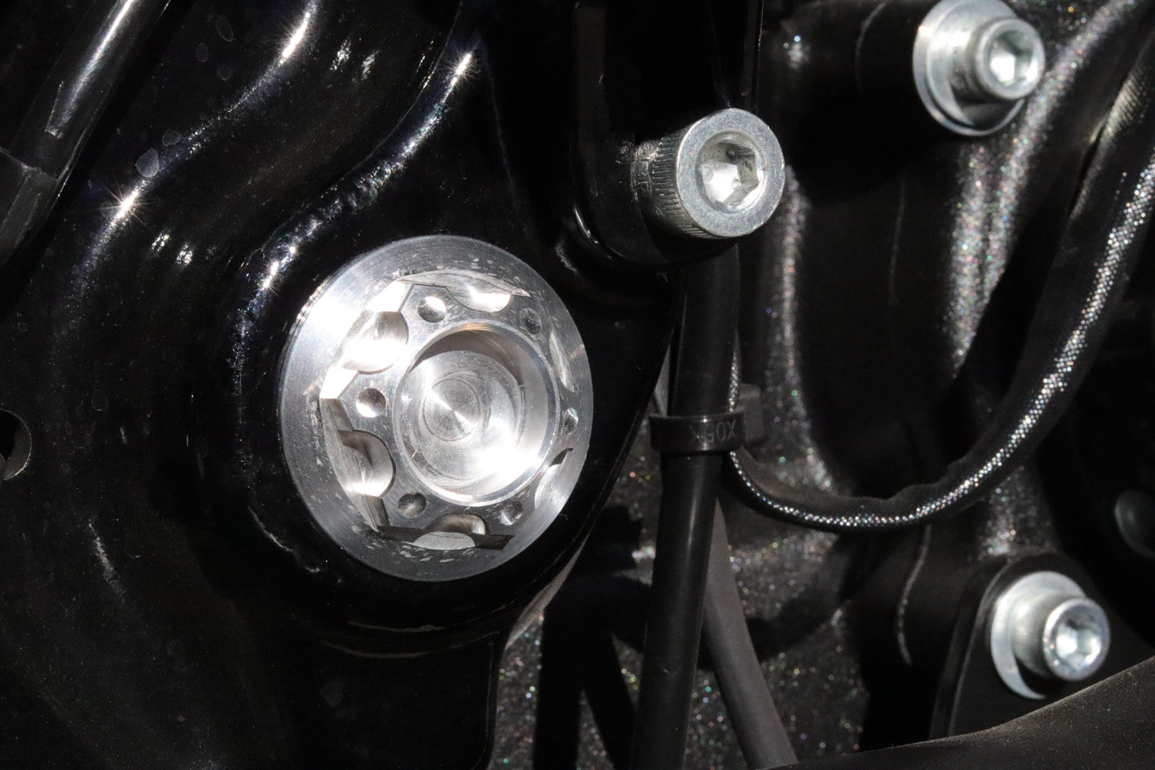 Swingarm pivot shaft cover