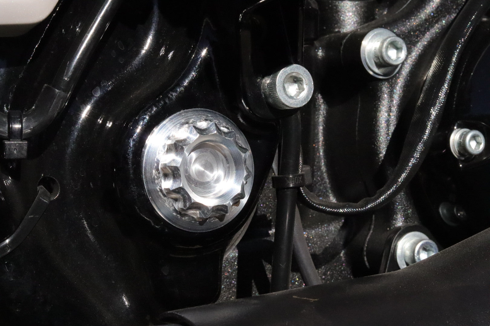 Swingarm pivot shaft cover